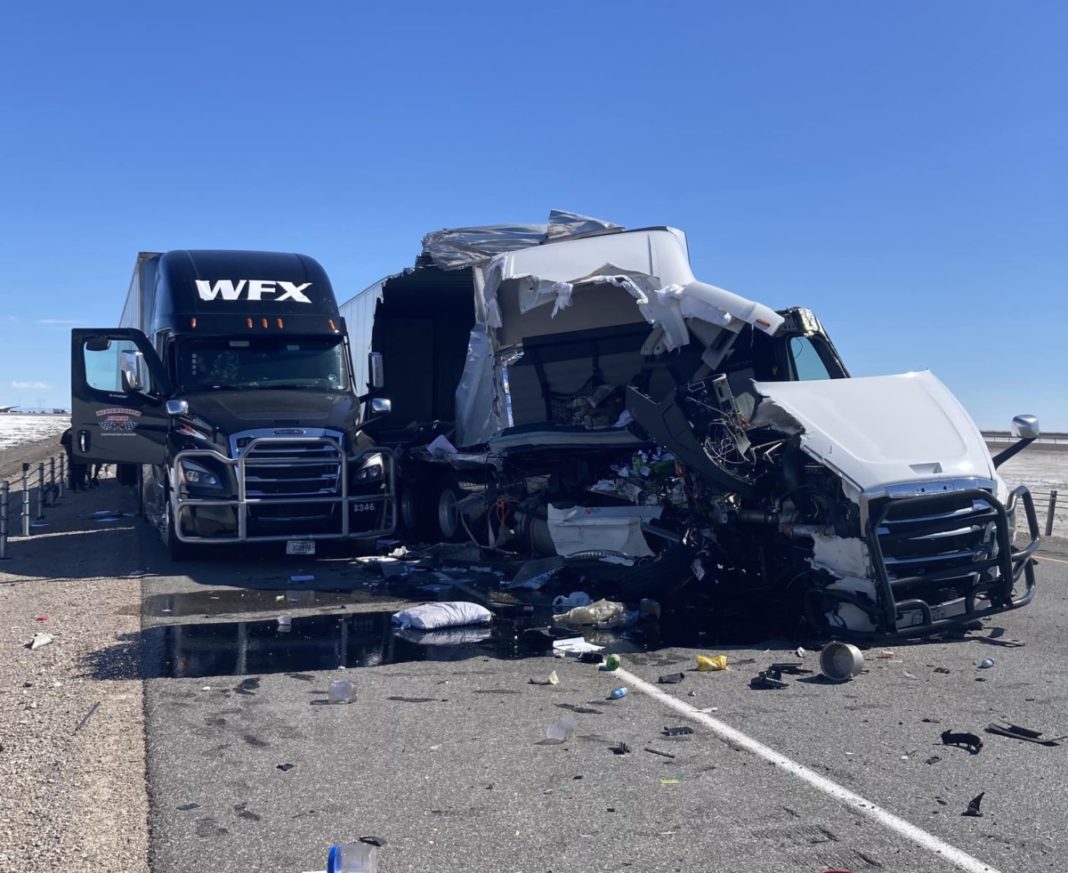 One hurt after semi truck struck big rig parked on I80 shoulder