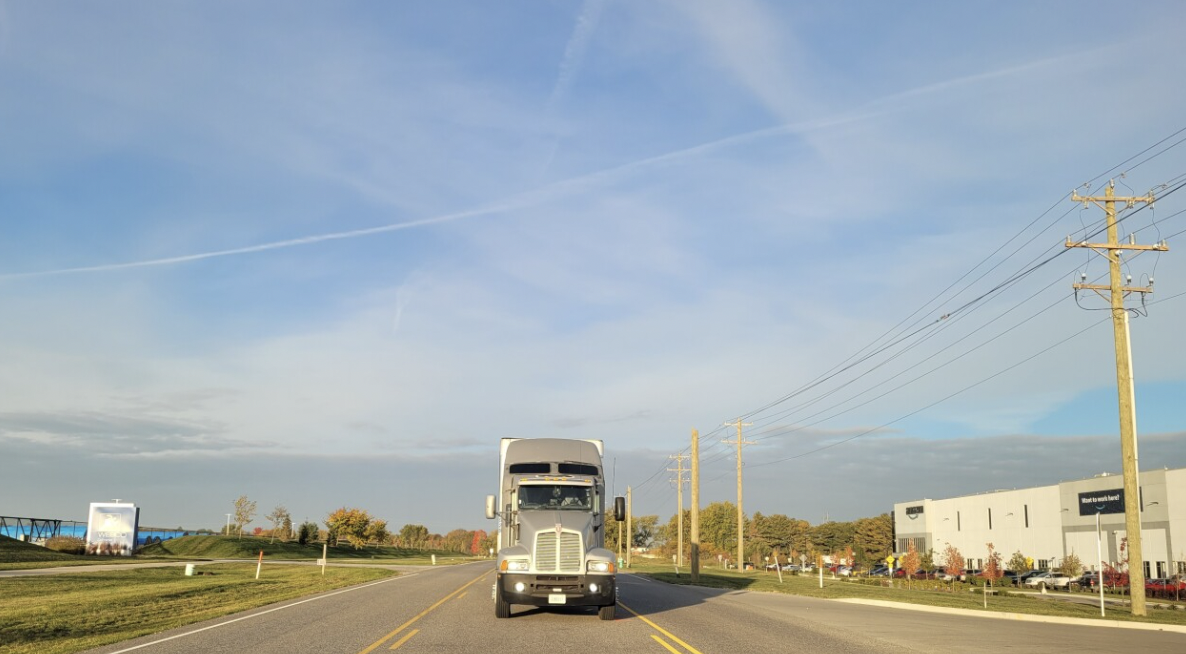 Standing trucker struck and killed by second driver after parking in center turn lane 