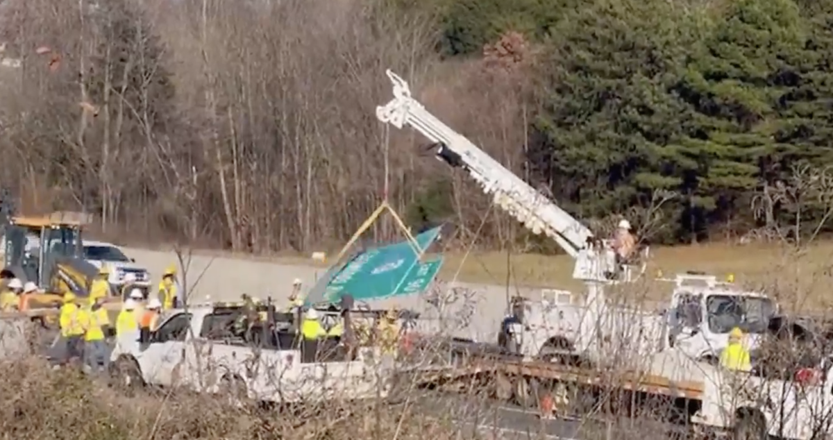 Interstate blocked by highway sign pulled down by semi truck’s load 