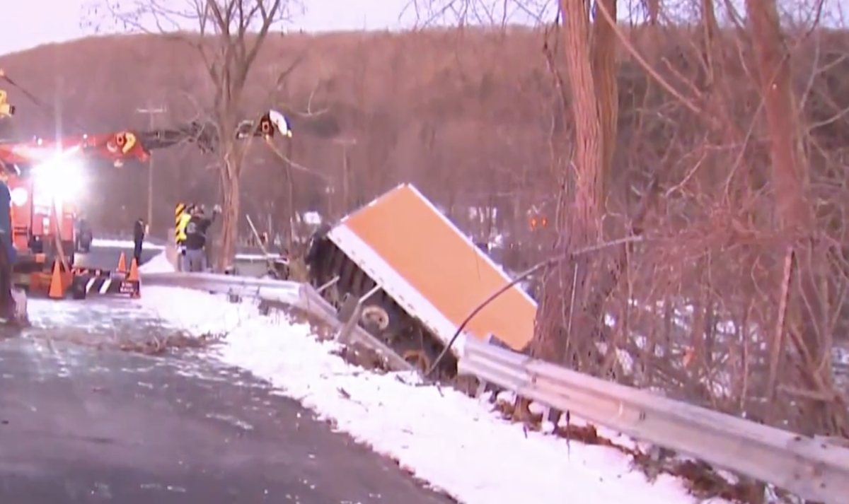 Road closed for semi crash off overpass 