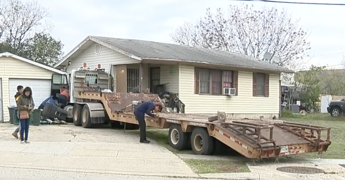 Driver falls out of cab after motorist’s road rage antics send semi truck crashing into house