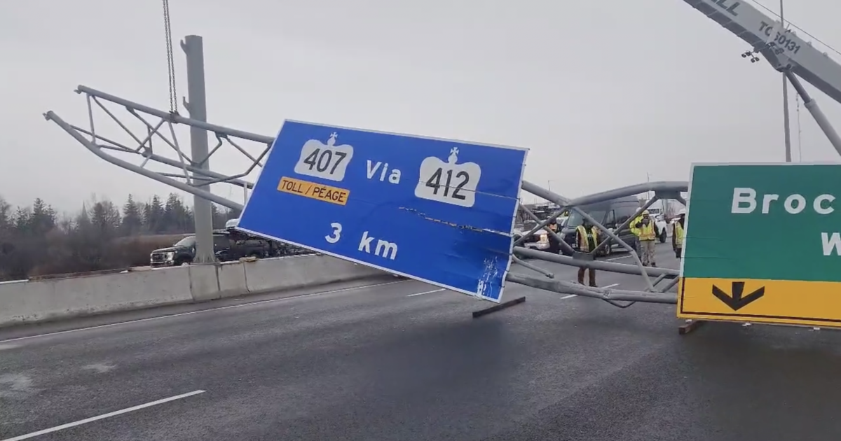 ‘We know who you are’ — Truck with raised box takes down highway sign