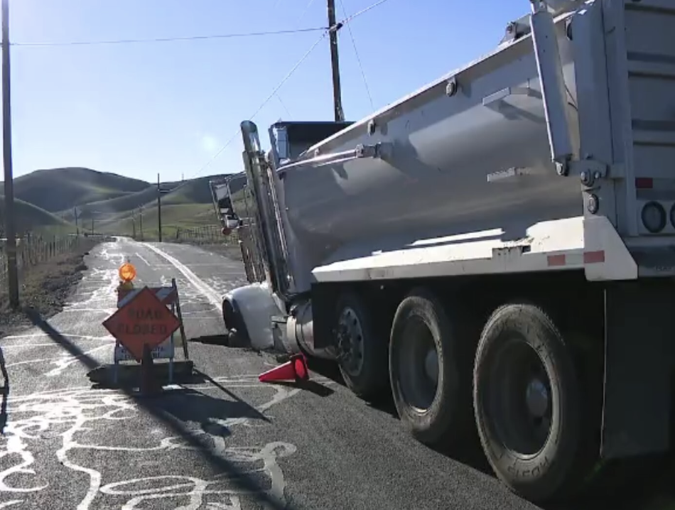 Close Call: Officer Dodges Truck Ignoring Road Closure