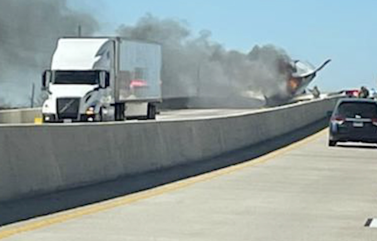 Plane clips roof of semi truck during emergency highway landing 