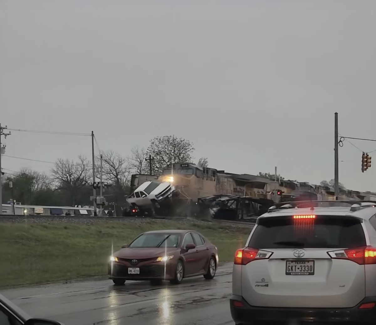 Train vs. car hauler collision caught on video in Texas