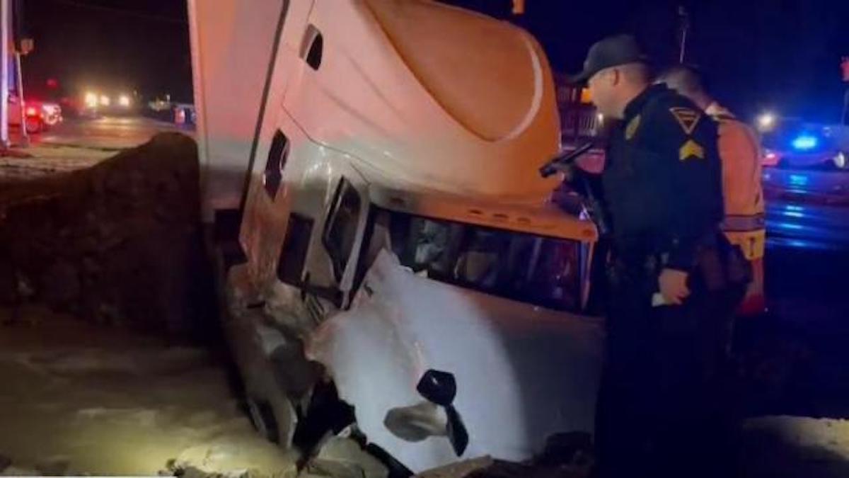 Officer thrown into sinkhole by semi truck unable to avoid barricade 