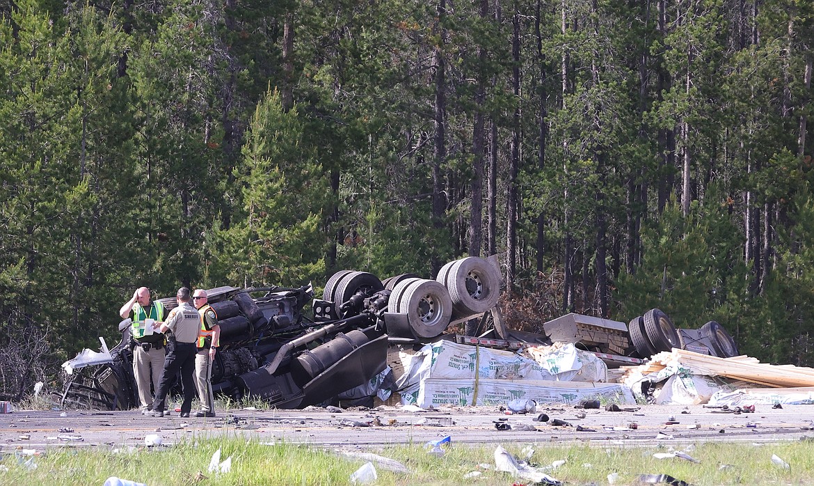 Sudden brake leaves flatbed upside down, two cars crushed 