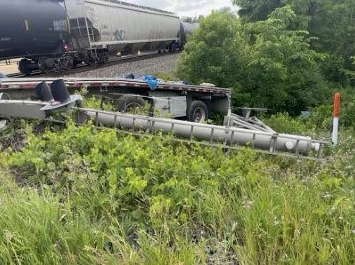 Truck driver tried to go around crossing arms before semi trailer was struck by train, troopers say