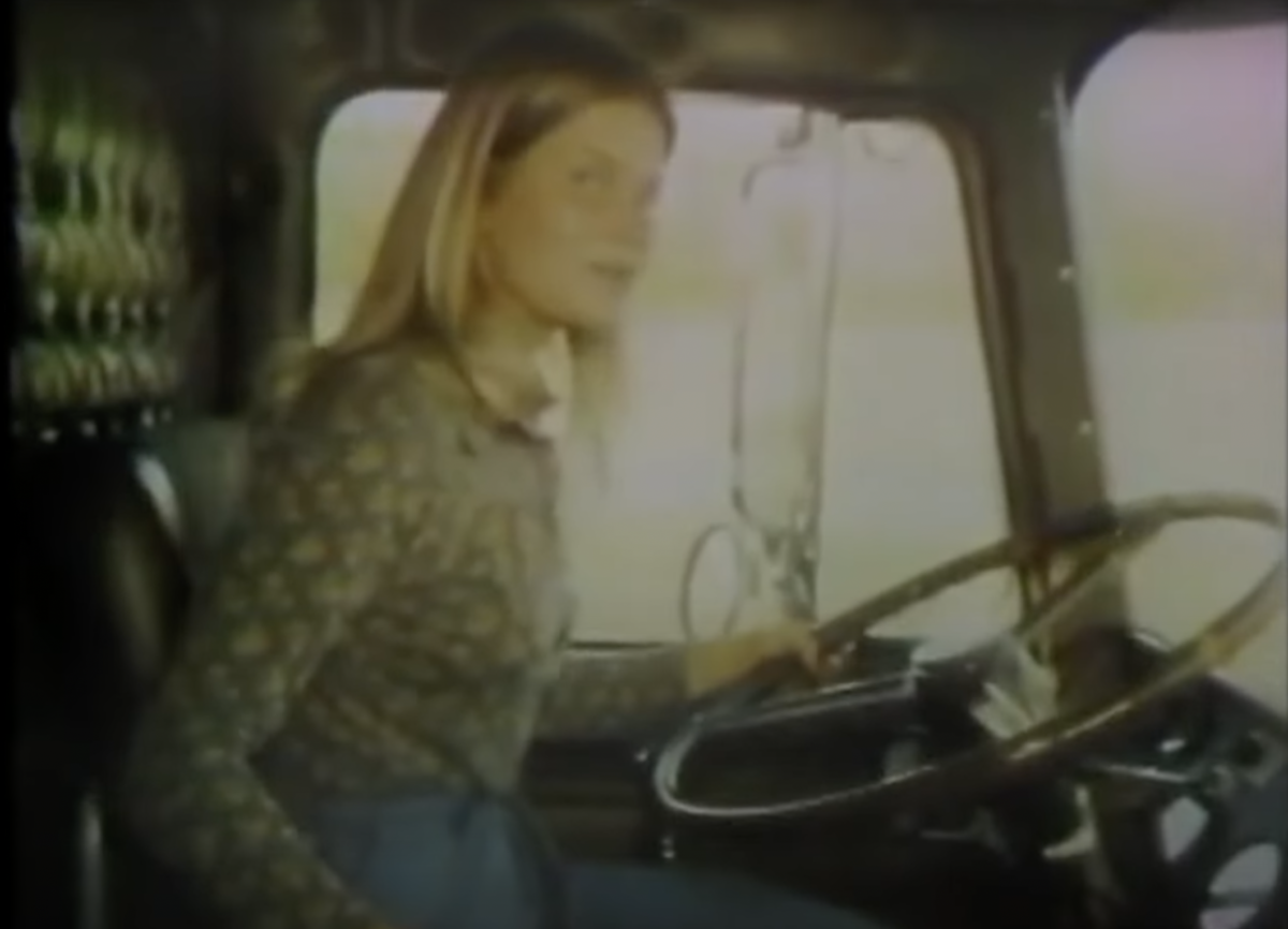VIDEO: Old school news segment follows lady trucker in a cabover