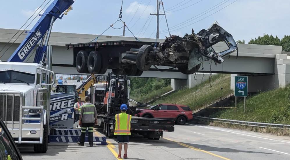 Airborne semi truck comes crashing off overpass 