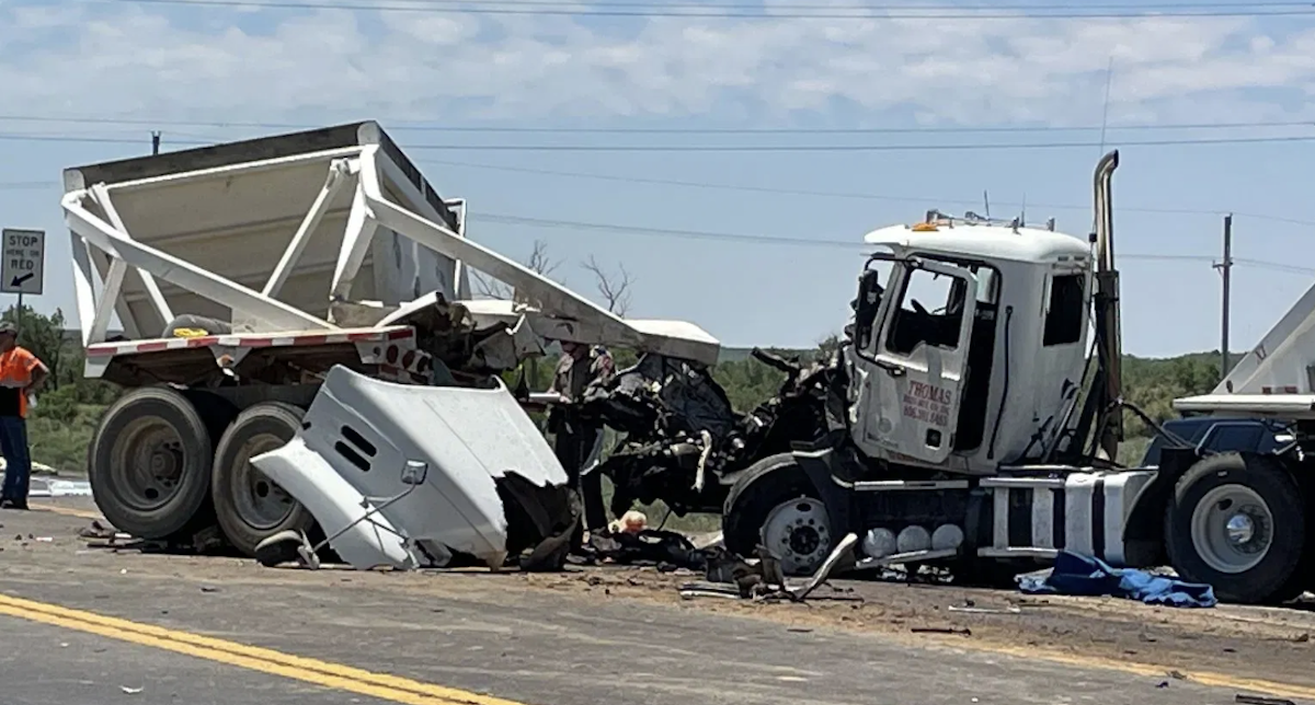 One dead, six injured in red-light wreck between two semi trucks