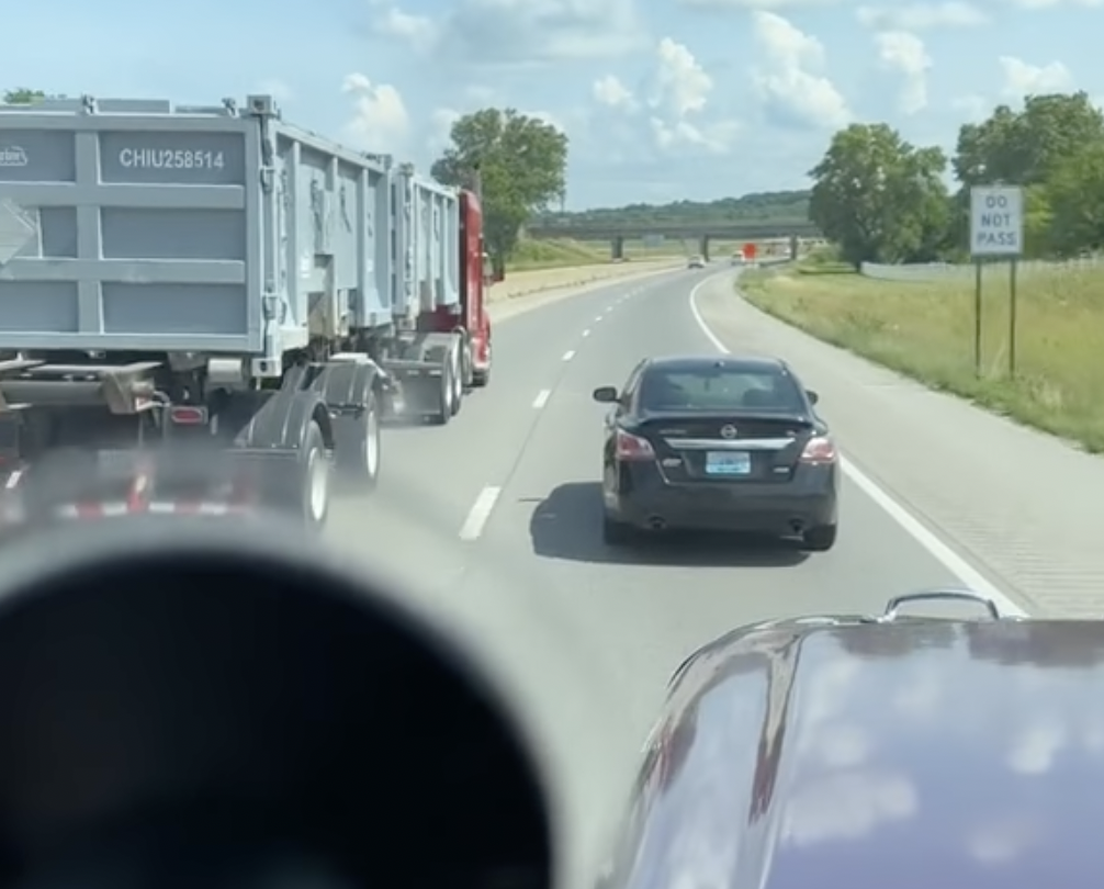 VIDEO: Truckers team up against Altima driver playing games