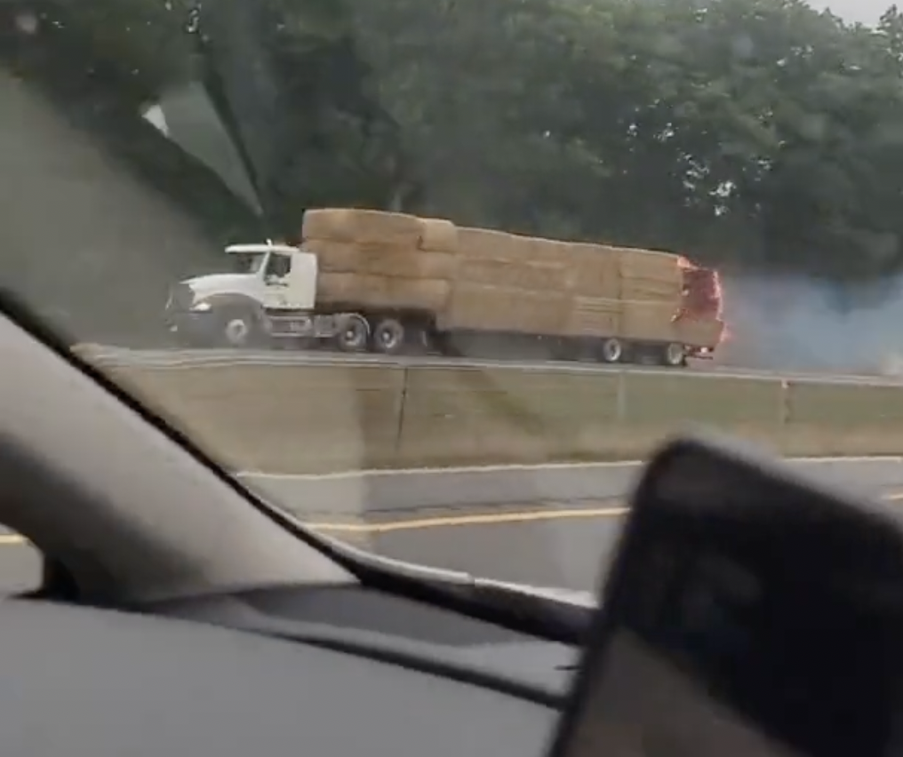 VIDEO: Hay truck driver with a very hot load leaves ‘trail of fire’