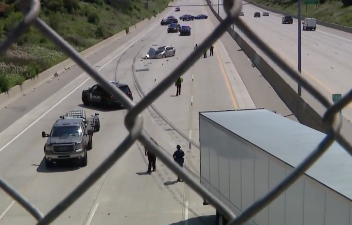 Trucker deftly avoids person who exited car in the middle of the highway 