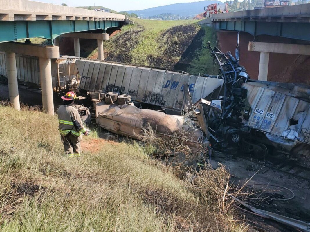 trucker-killed-in-crash-off-bridge-that-ended-on-top-of-parked-train