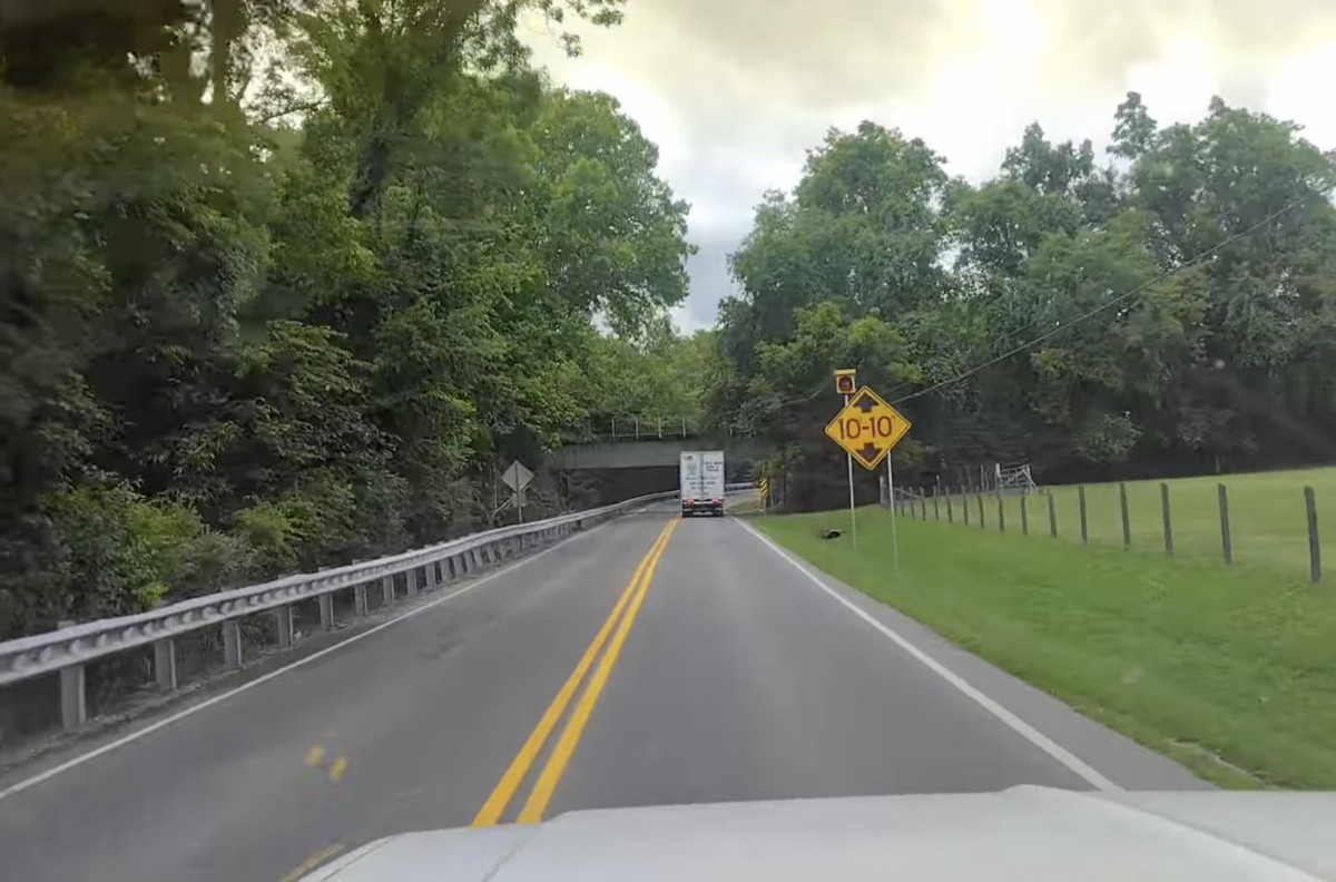 VIDEO: Box truck driver zooms past 10’10” signs moments before can opener crash