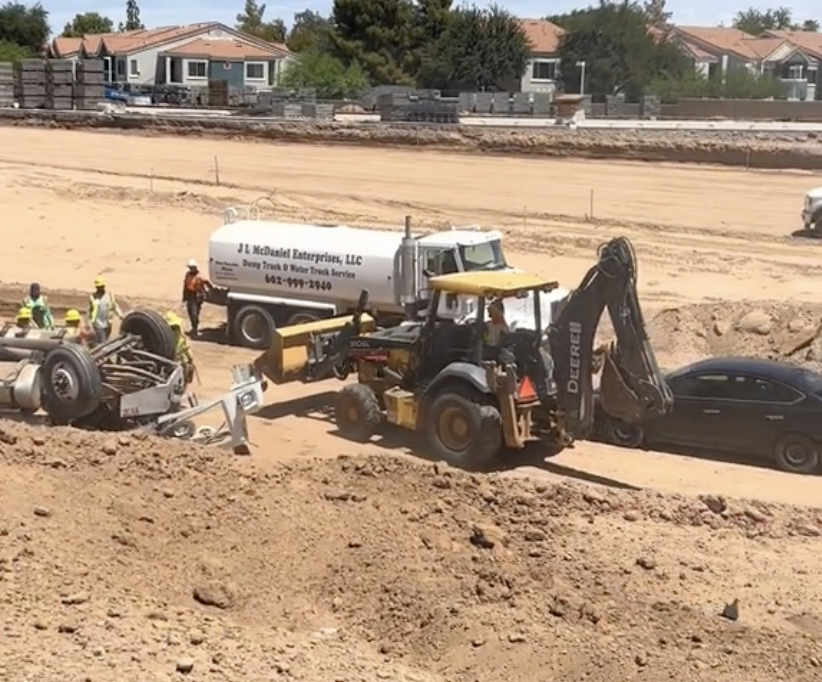 Video shows Arizona construction crews rescuing flipped truck driver