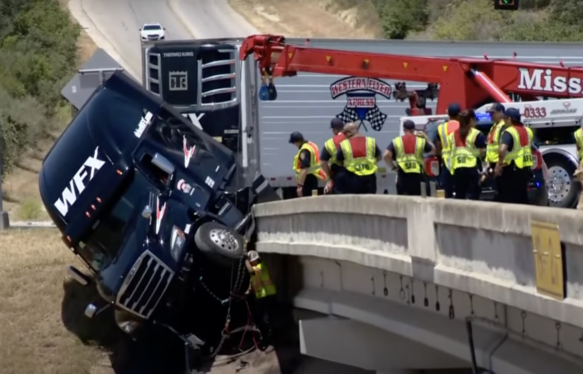 Rig left hanging off bridge after motorist’s poor lane change