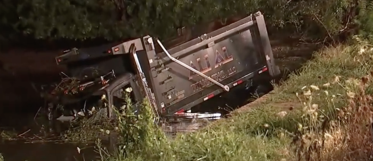 Body of dump truck driver lost in river for hours 