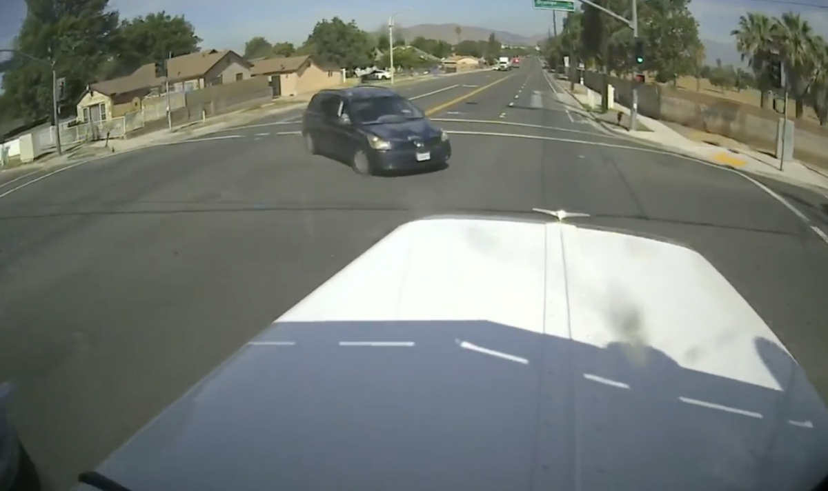 VIDEO: Motorist arrested after making a very confusing choice to turn slowly in front of oncoming semi truck