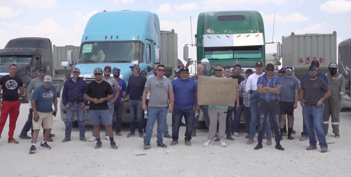 Small group of truckers gathers in protest of lowered rates, increased fees