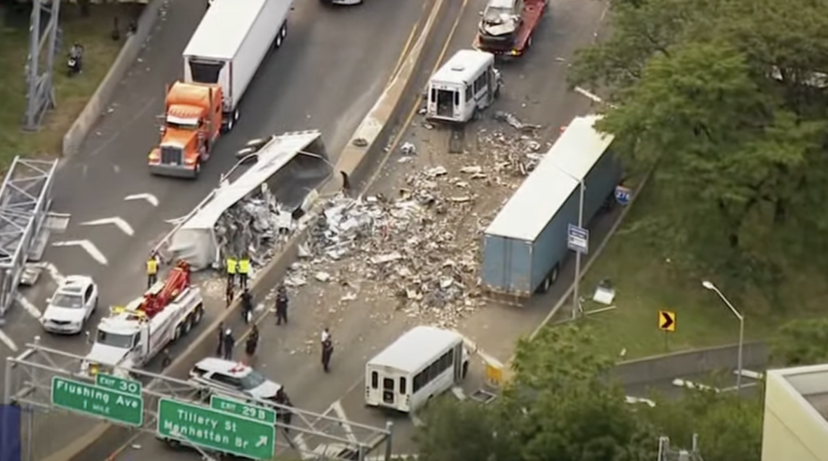 Four people injured after tractor trailers collide on BQE