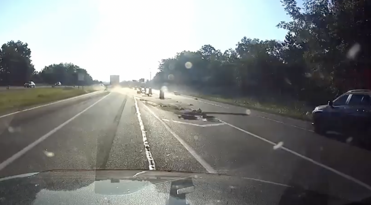 VIDEO: Semi smacks into construction zone, runs SUV off the road