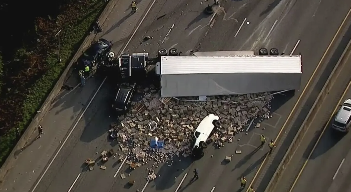 Seven vehicle pile up spills load of frozen chicken 