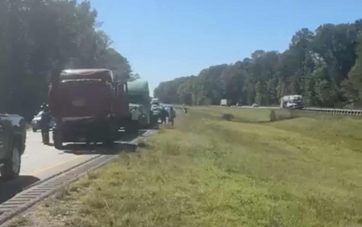 Motorist caused pile-up of three semi trucks by stopping in middle of traffic to use emergency-only turnaround 