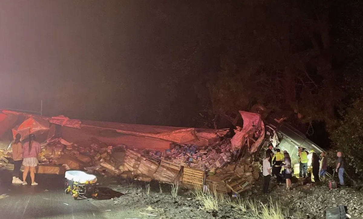 Second tractor trailer plows through overturned semi truck investigation 