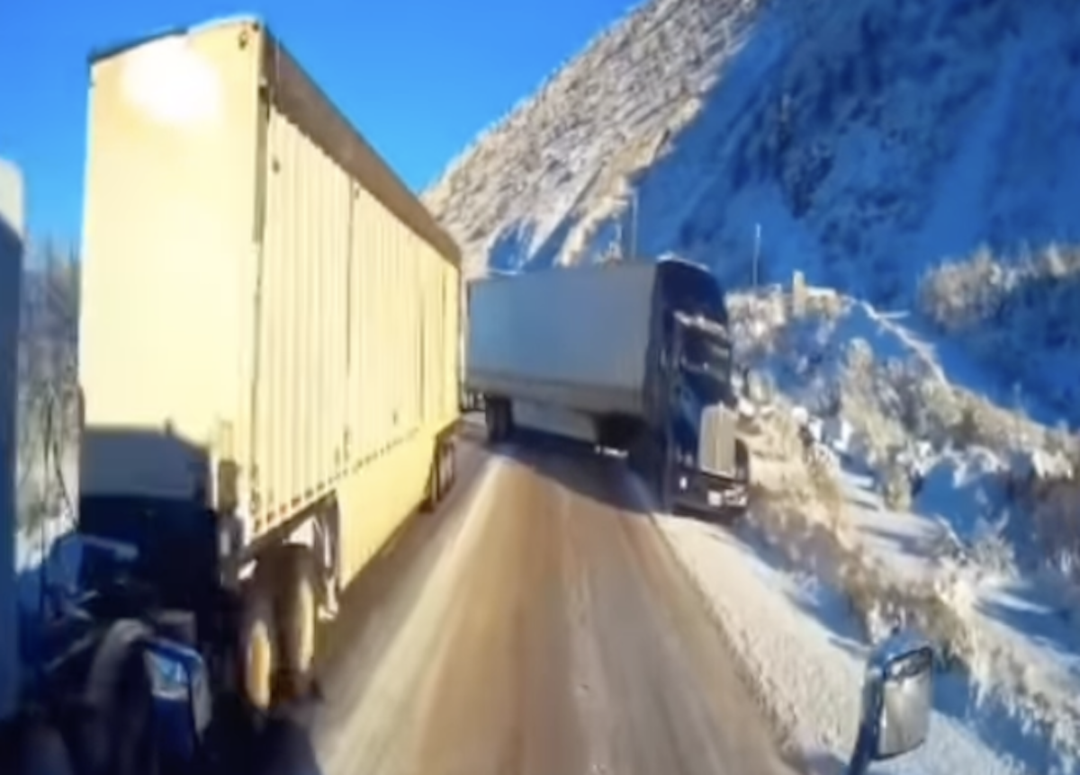 WATCH: Trucker successfully threads the needle through potential truck pile-up