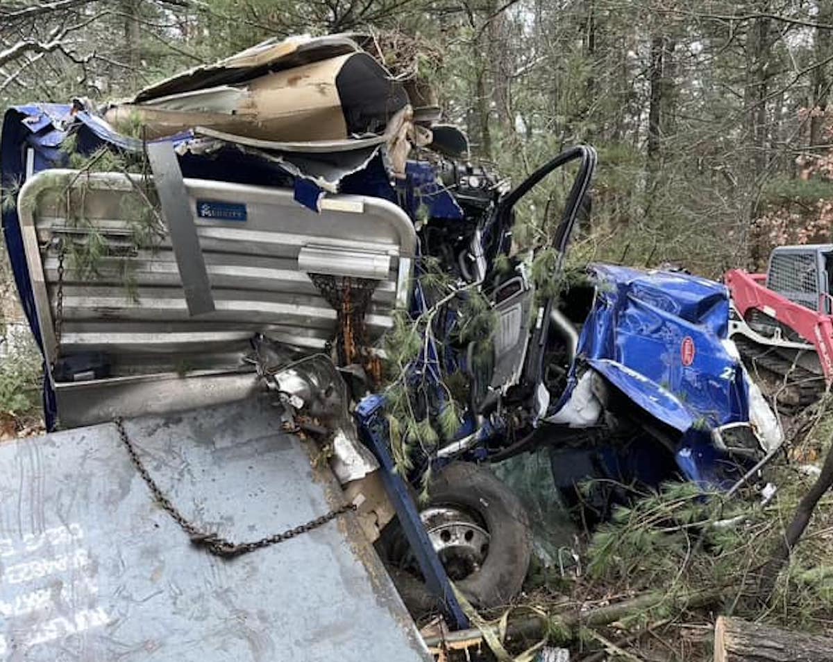 Load shift and multiple trees demolish cab but trucker still manages to walk away 