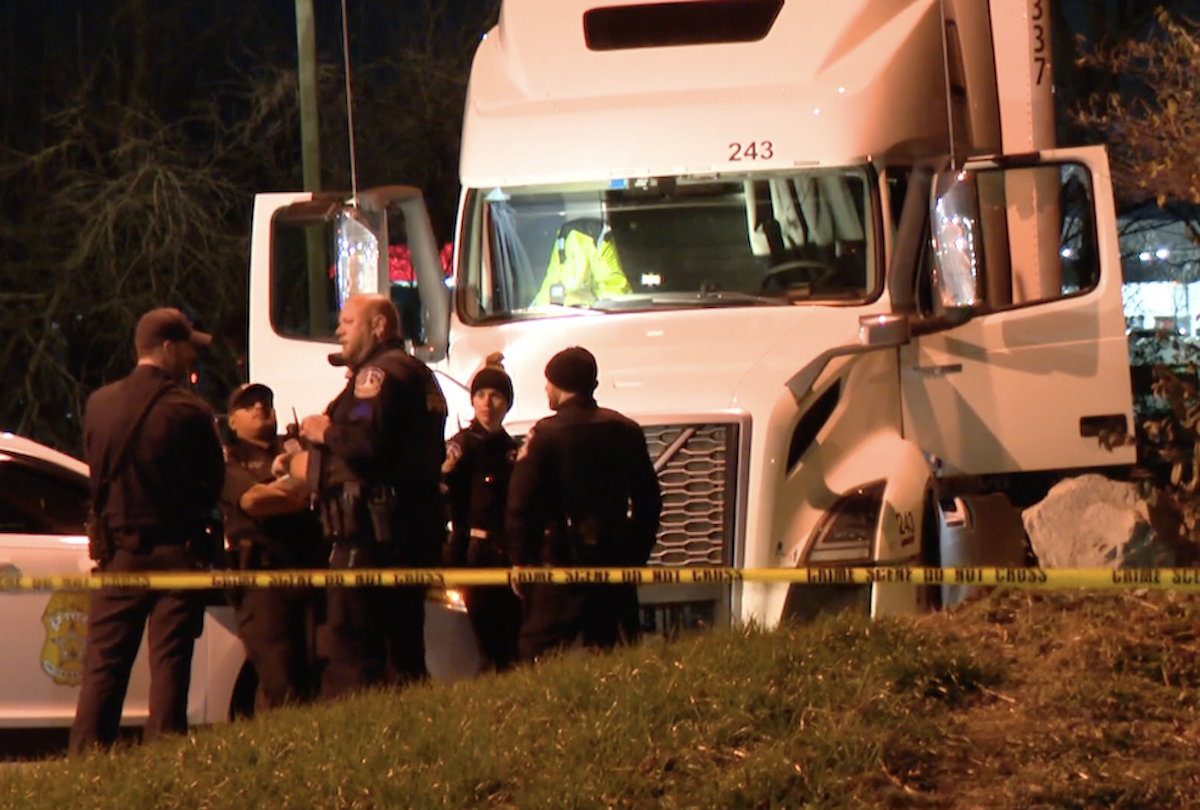 Truck driver fatally shot by officer inside truck cab while threatening woman with knife