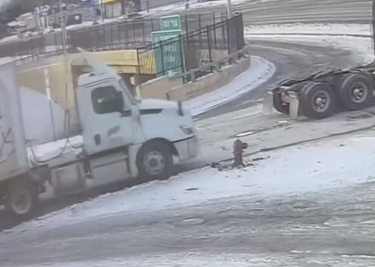 Truck driver rips open fire hydrant during shortcut through parking lot, forcing closure of freeway in icy mess