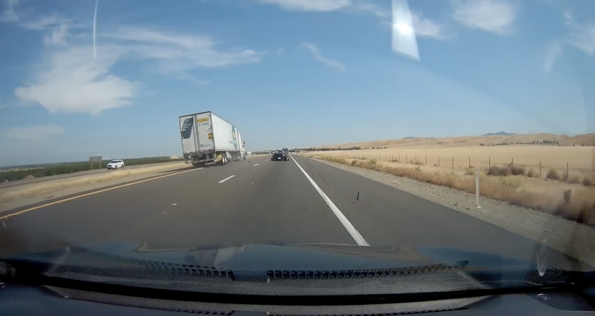 VIDEO: Truck driver makes a save after striking a car in his blind spot while changing lanes