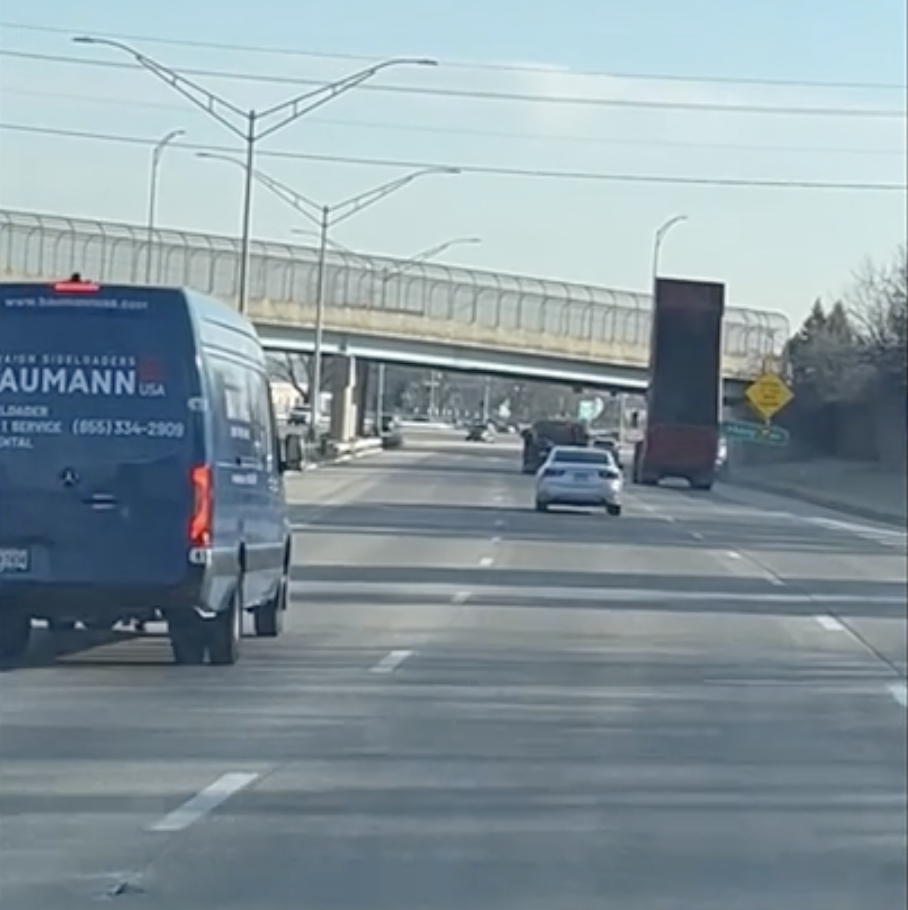 VIDEO: Dump bed violently torn from truck during bridge strike in Dayton