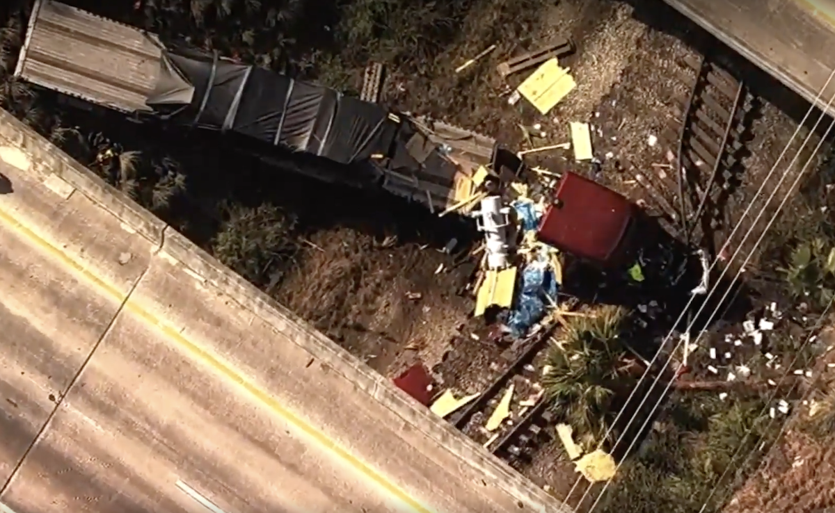 Truck driver dies after semi truck flies off overpass