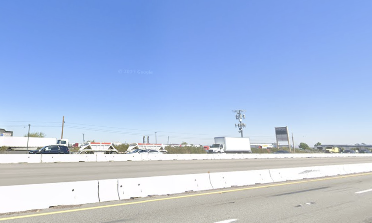 Man jumps onto moving semi truck stuck in slow traffic