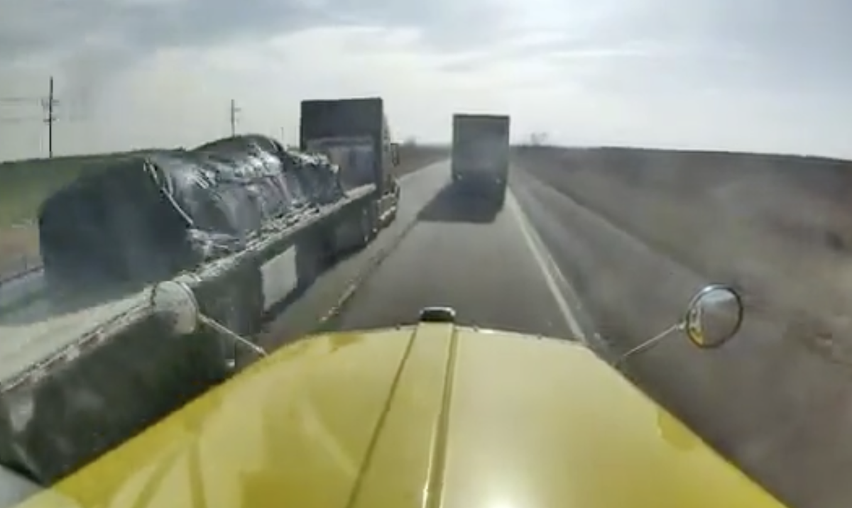 Trucker parts traffic like the red sea just to pass line of semi trucks