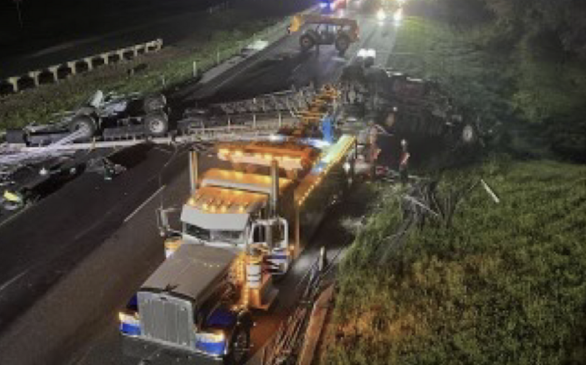 Six people inside cab of semi truck that flipped upside down