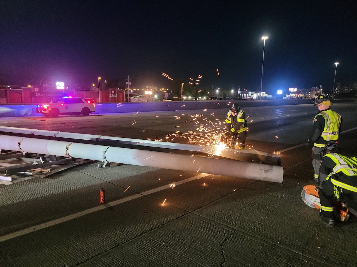 Semi smacked by highway sign on windy morning