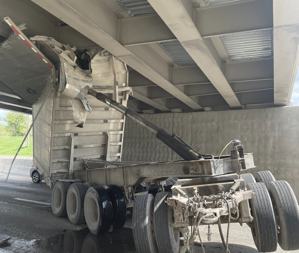 Dash cam catches gravel hauler striking Detroit overpass