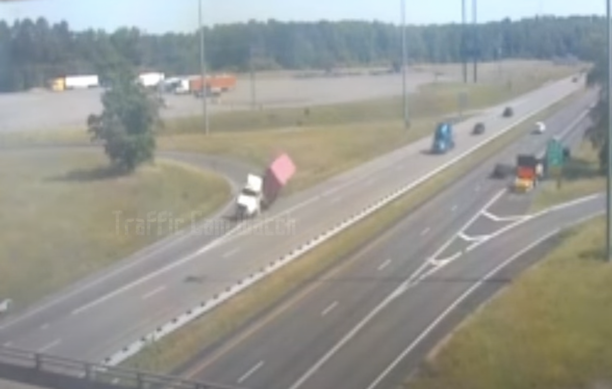 Video catches container hauler toppling on ramp, causing collision with bobtail truck