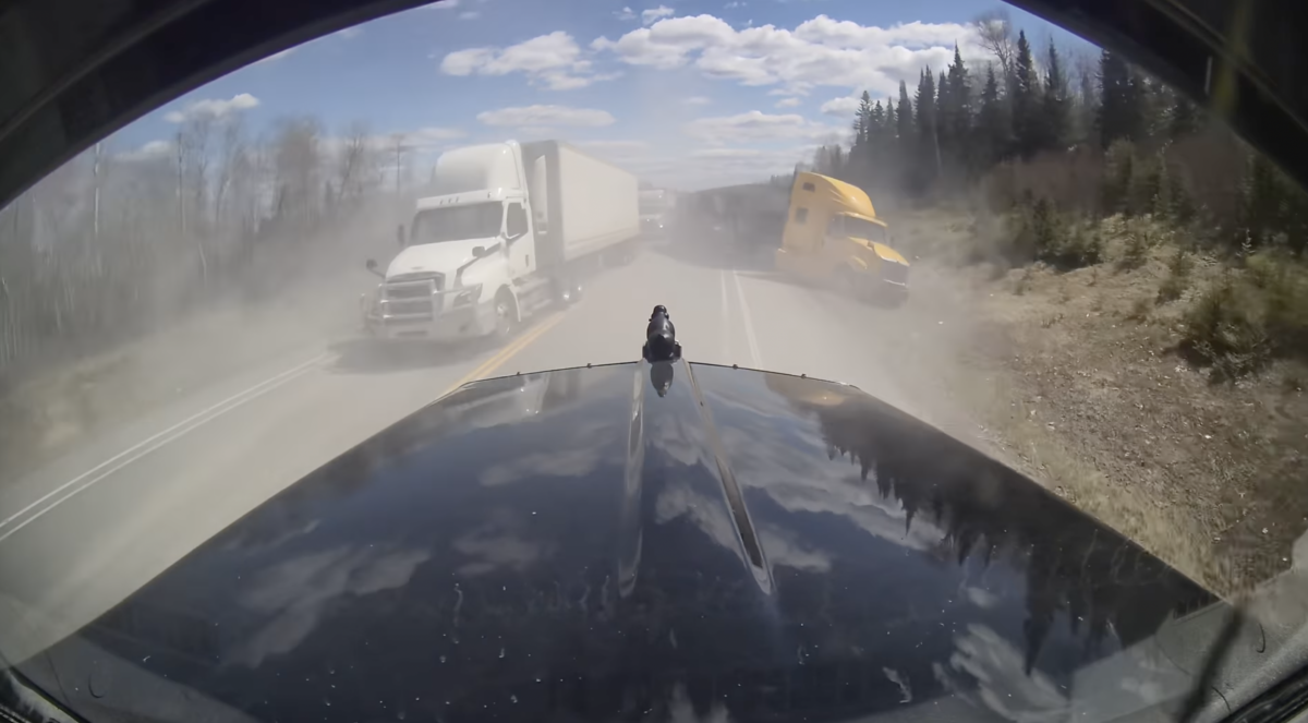 Chaotic dash cam video shows trucker threading the needle through a bunch of big rigs