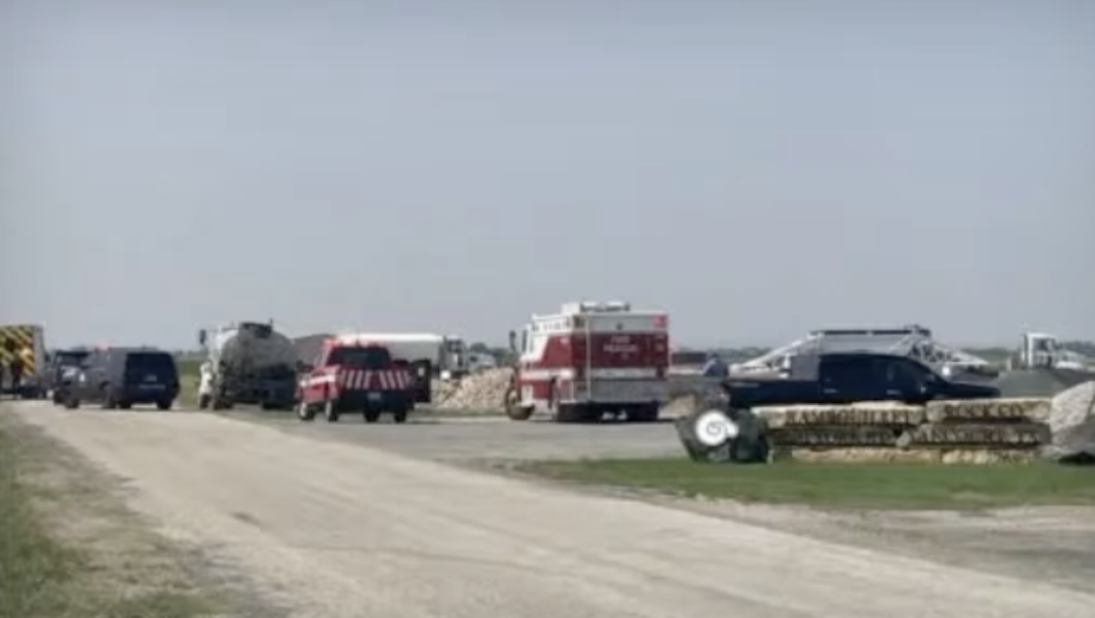 Mack tanker truck backs over pedestrian