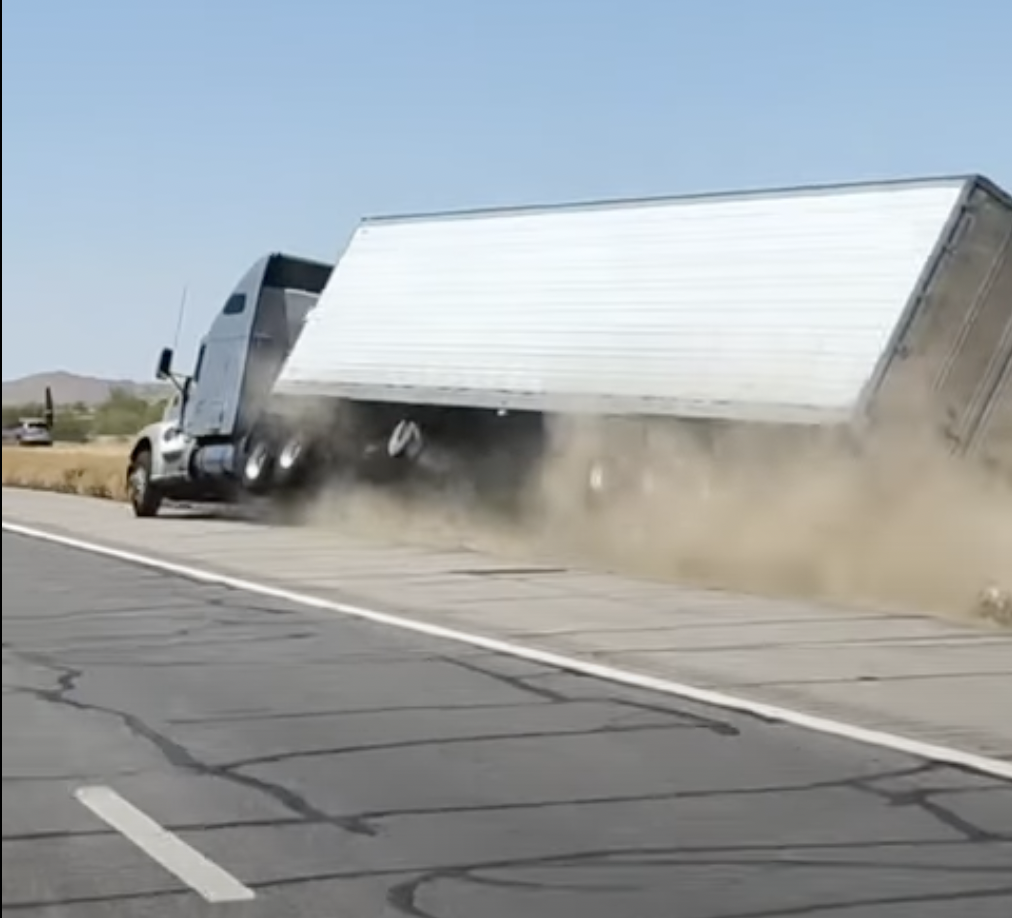 Dramatic video shows big rig veering off shoulder, rolling over