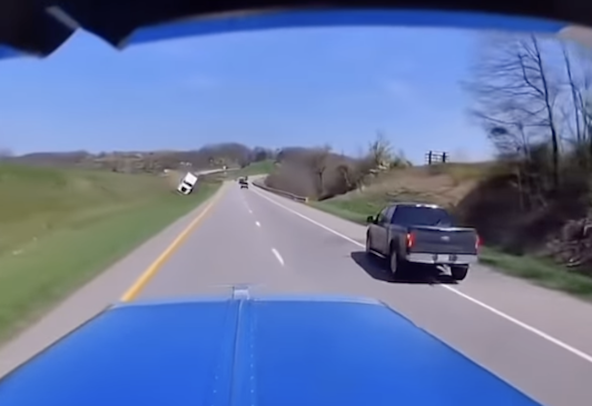 Watch as trucker makes evasive maneuver to avoid rig barreling across median