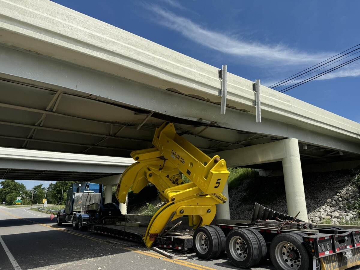 Trucker charged after oversized load strikes Ohio overpass