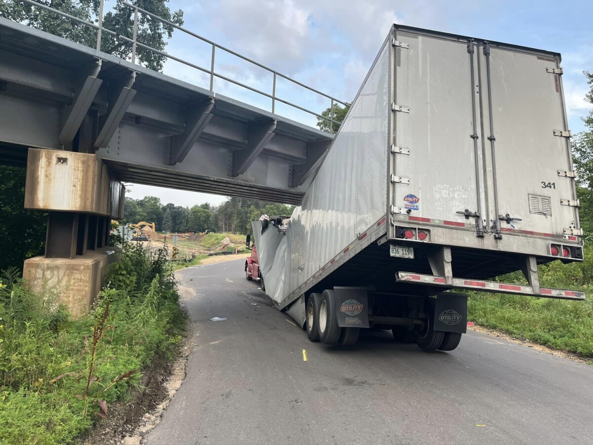 ‘Lost’ driver mangles semi truck and trailer on low railroad bridge