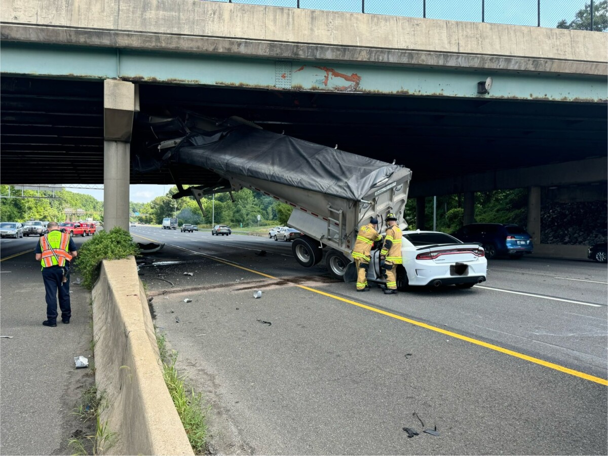 One hospitalized after commercial vehicle strikes bridge, car strikes detached trailer